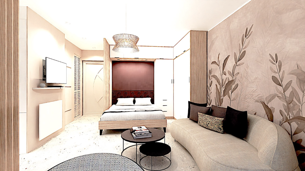 Studio Mandelieu Chambre moderne avec lit, télévision et salon au design élégant et lumineux.