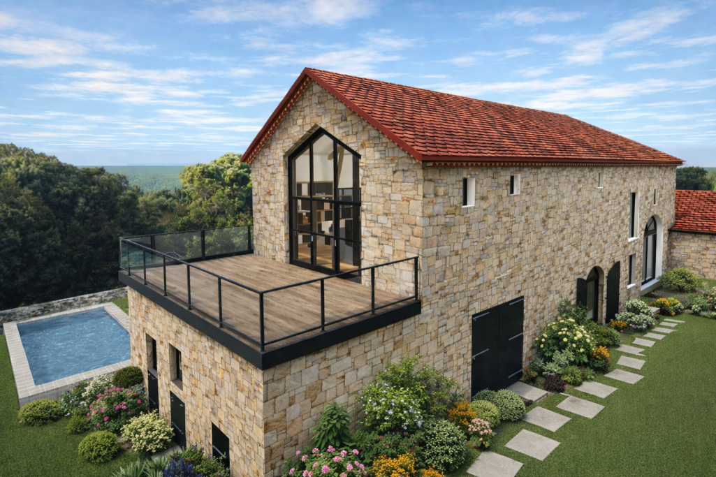 Aménagement de grange dans le Lot Maison en pierre avec un toit rouge, terrasse, piscine et jardin fleuri.